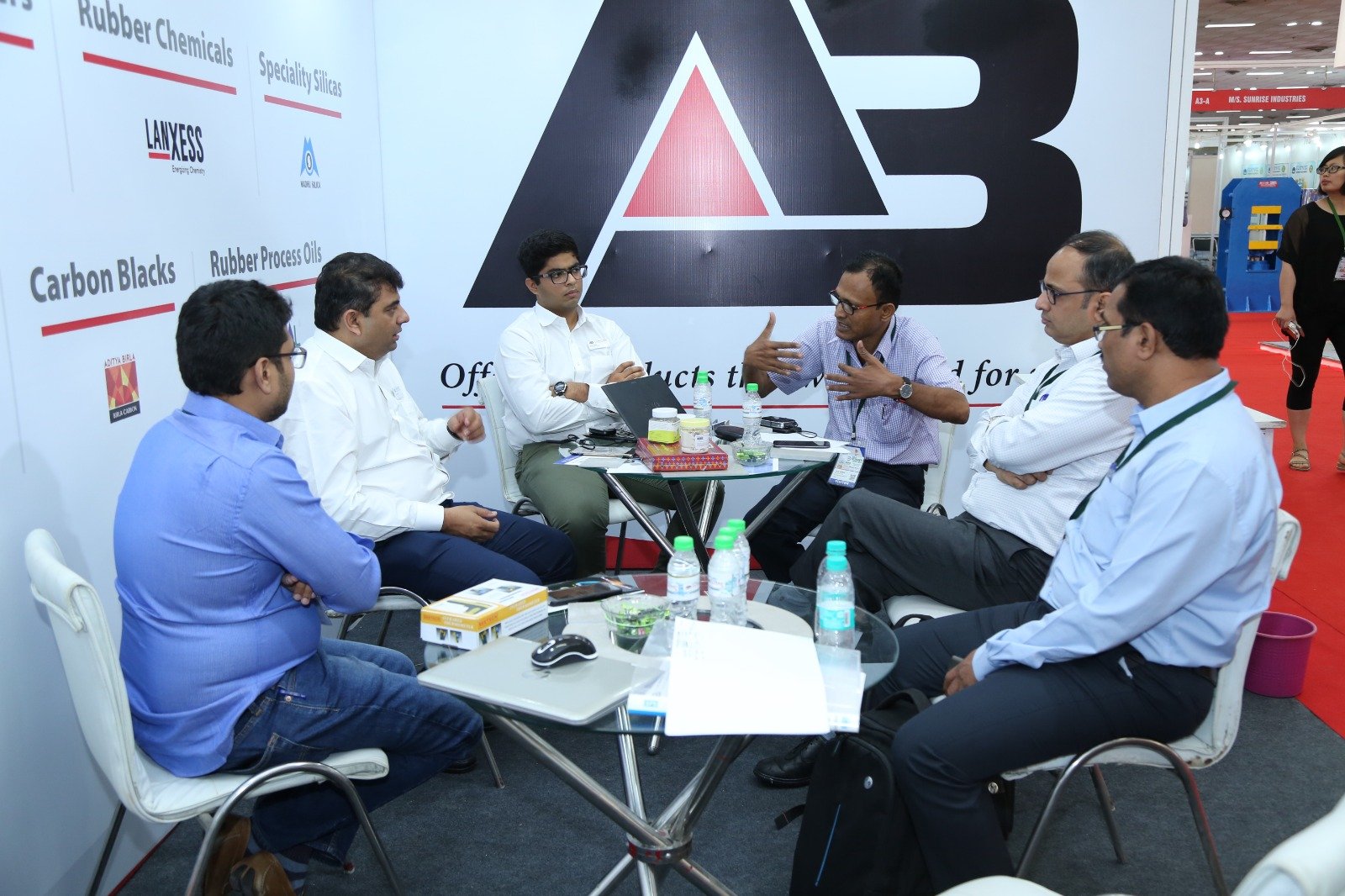 Exhibition booth showcasing rubber industry products.